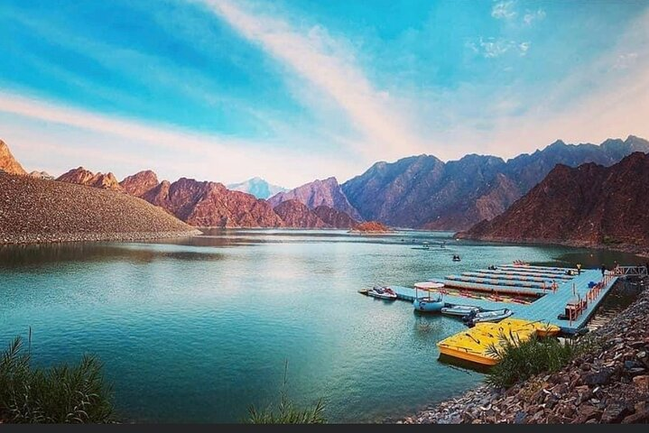 Discover the serene beauty of Hatta where majestic mountains meet clear waters creating the perfect backdrop for exploration and unforgettable experiences in Dubai’s hidden gem.